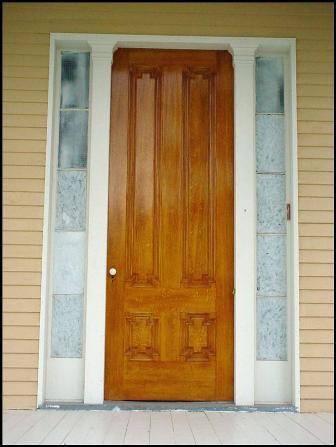 Oak-grained front door reinstalled